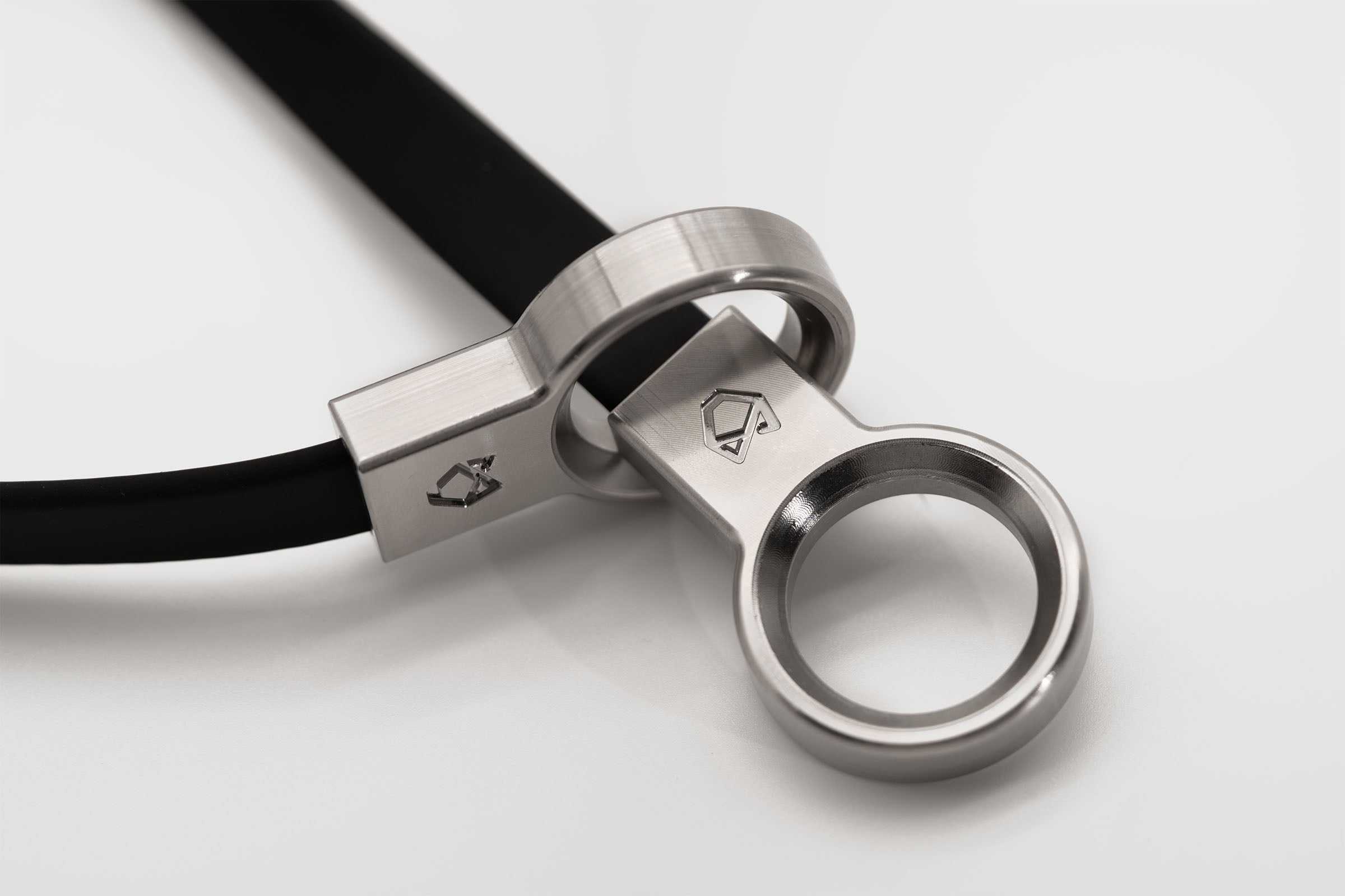 Detailed view of the interlocking CNC machined stainless steel hardware components of the Little Lupo Collar C3, demonstrating its superior craftsmanship and durability.