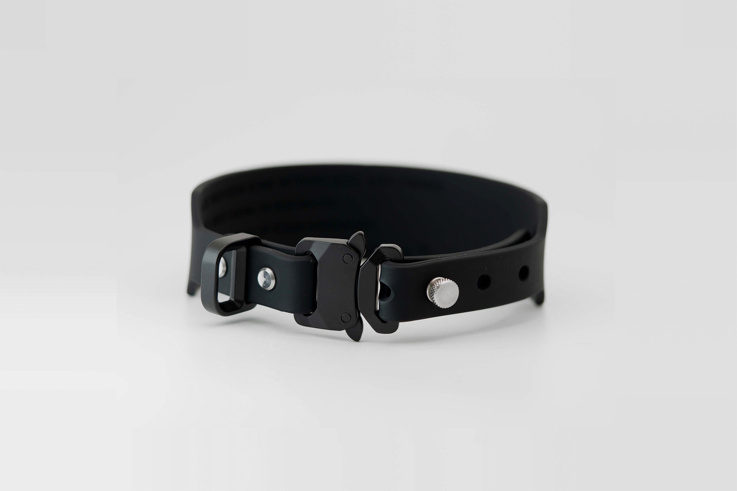 Little Lupo Collar C2 coiled on a white surface, revealing its smooth and tough LFGB silicone material, waterproof nature, and zero-fabric construction.