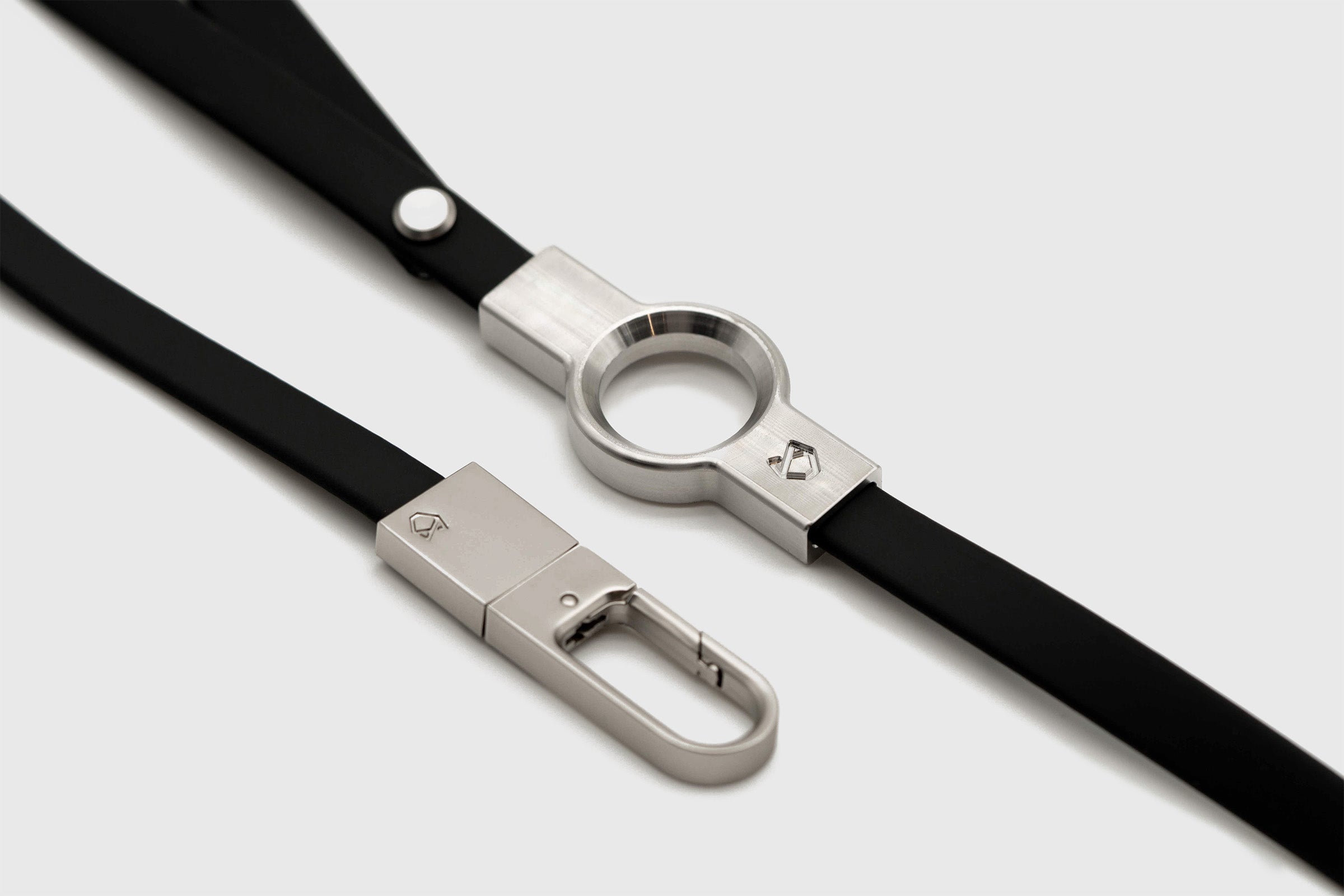 Close-up of Little Lupo Leash L1's matte black silicone-coated nylon webbing and polished stainless steel hardware, showcasing the durable, elegant design.