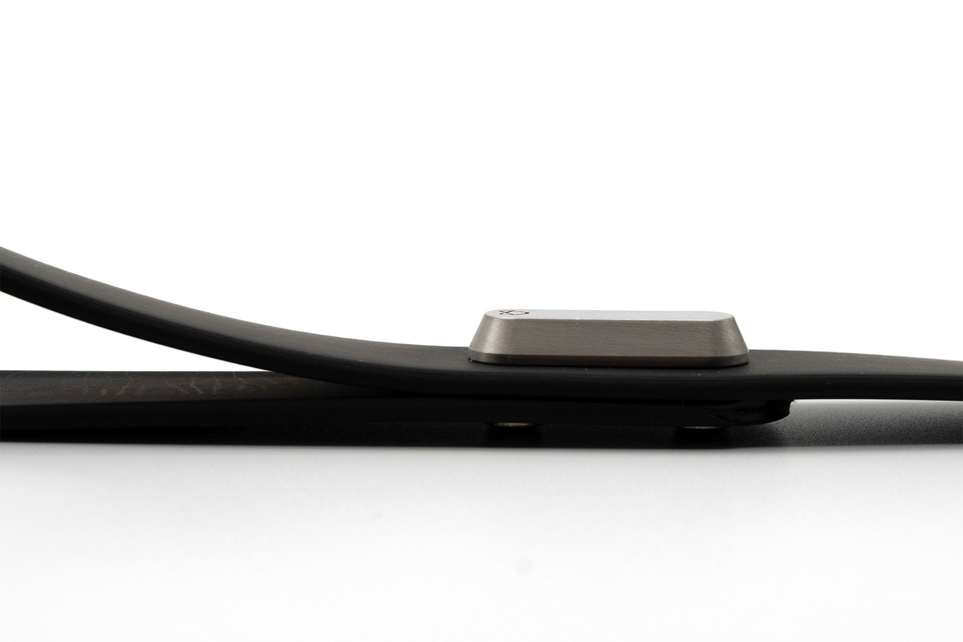 Later view of the Little Lupo Leash L4 on a white background, emphasizing its sleek profile, flexible silicone-coated tactical nylon webbing, and the striking stainless steel monument.