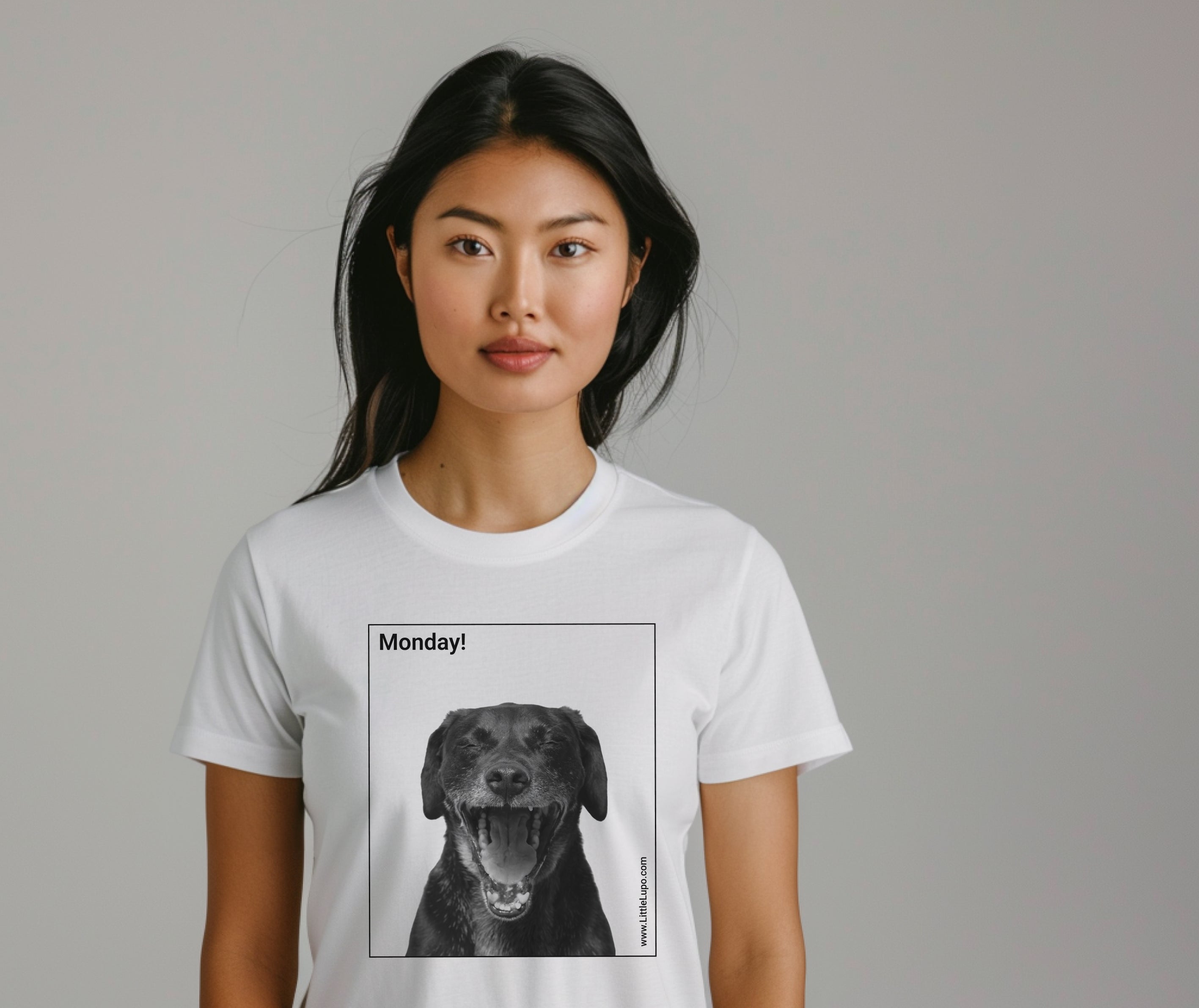 White Little Lupo t-shirt on a young adult woman with a humorous "Monday!" graphic featuring a screaming dog's face inside a black square, made from soft Airlume combed cotton for pet owners.