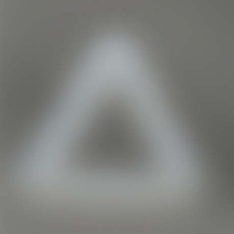 A blurred image of a white object against a gray background