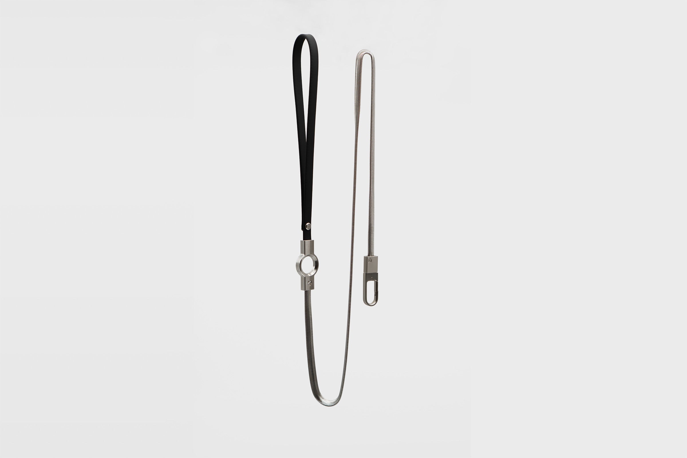 Full vertical view of the Little Lupo Subtle Strength Leash, showcasing the 54-inch stainless steel chain, black silicone coated handle, and secure clip, on a white background.