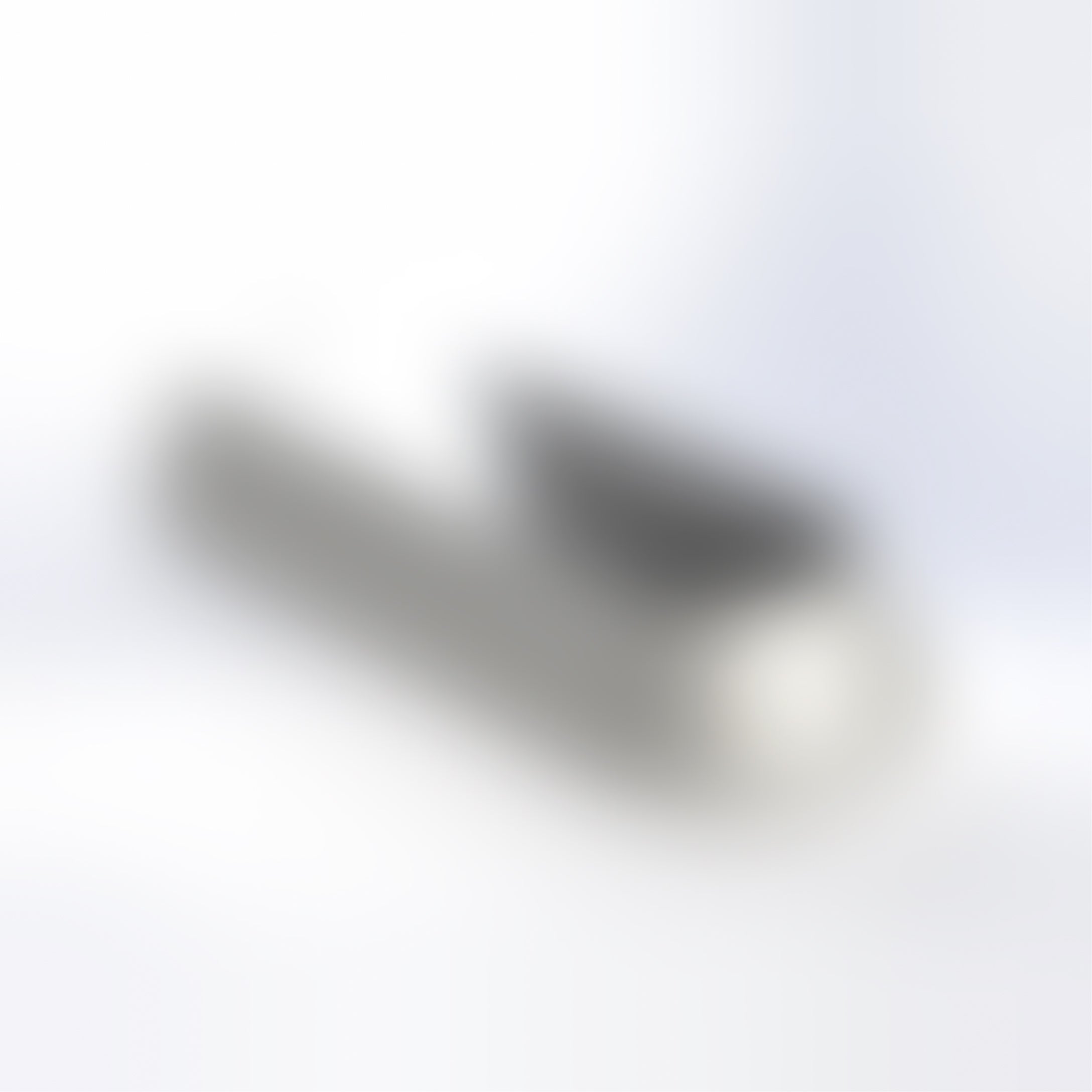 A blurred image of a pet accessory on a light background.