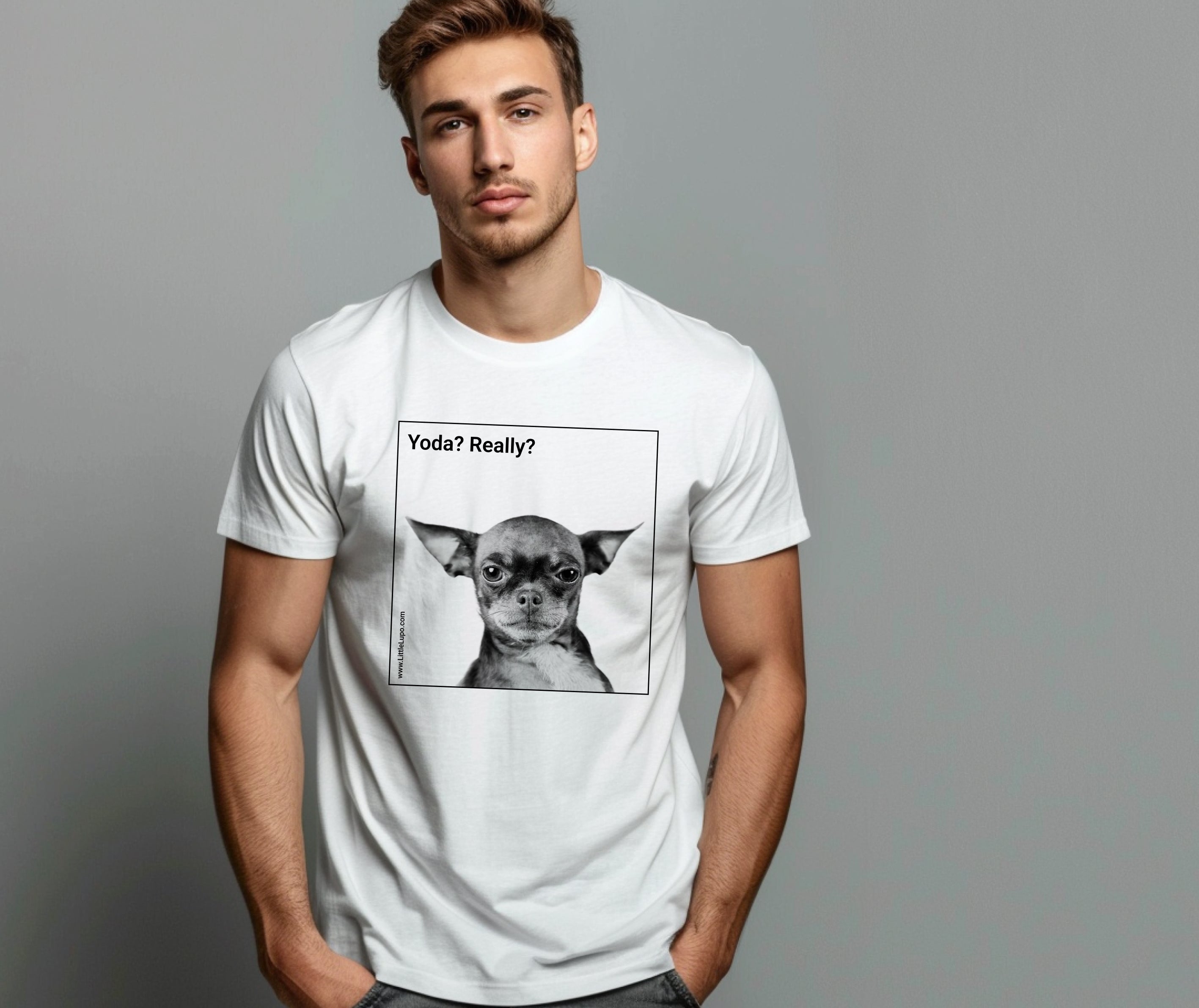 A man wearing a white Little Lupo t-shirt with a printed black and white image of a dog resembling Yoda from Star Wars, with the text 'Yoda? Really?'.