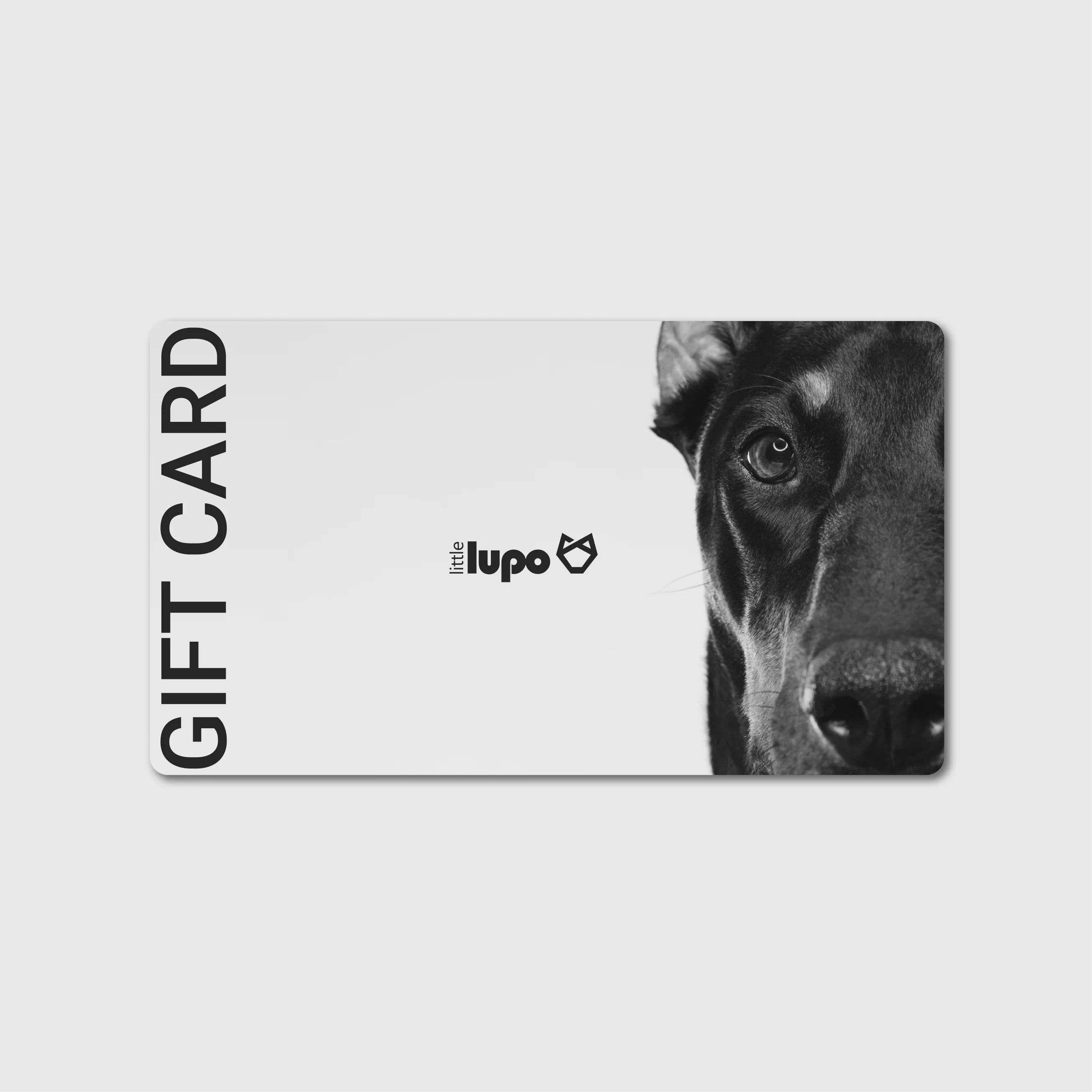 Top view of the Little Lupo e-gift card featuring a modern illustration of the left half of a dog's face, with the Little Lupo logo centered and "Gift Card" text on the right side, set against a light background.